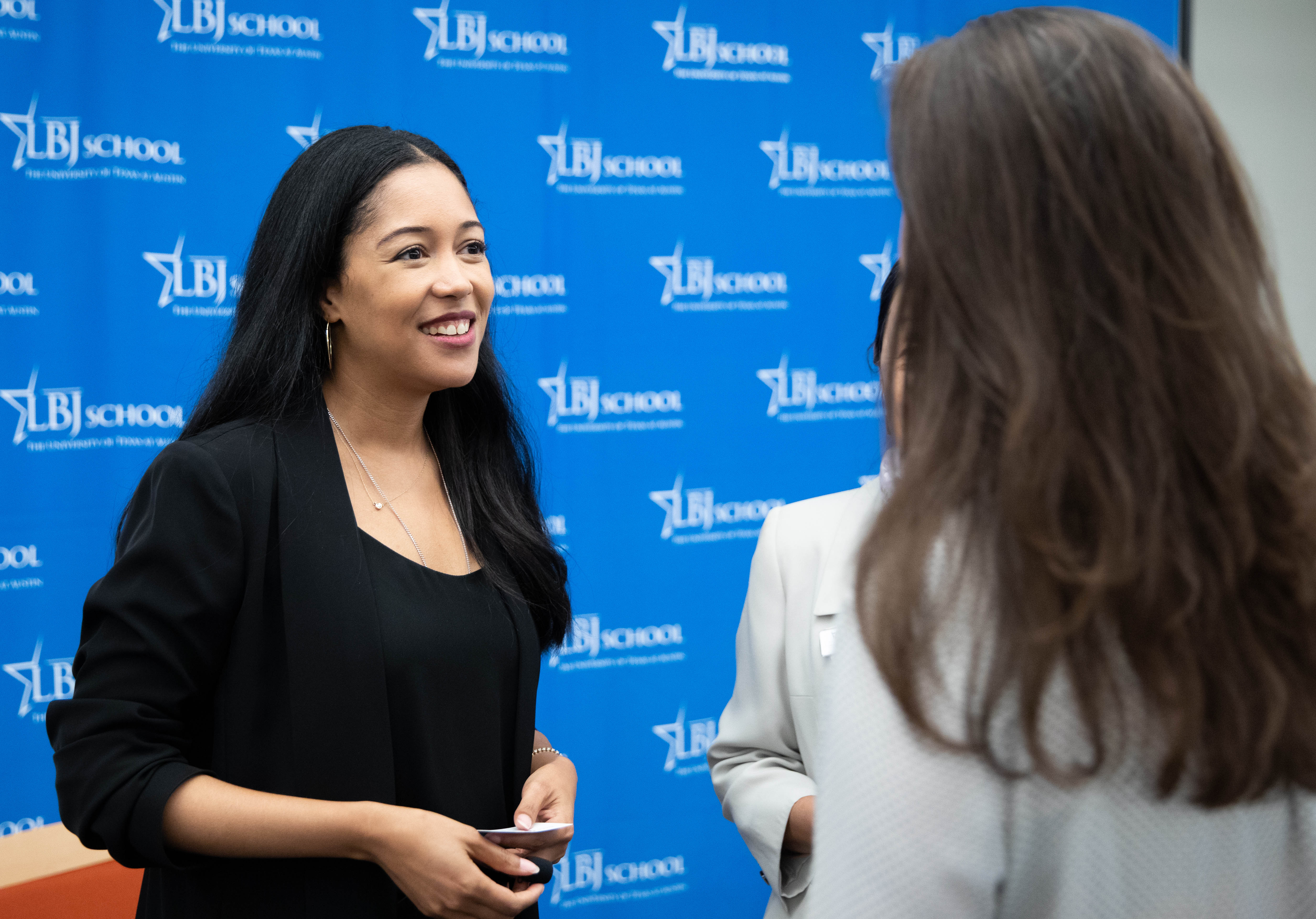 Annie's List Executive Director Royce Brooks talks with a student during a visit to the LBJ School on March 27, 2019