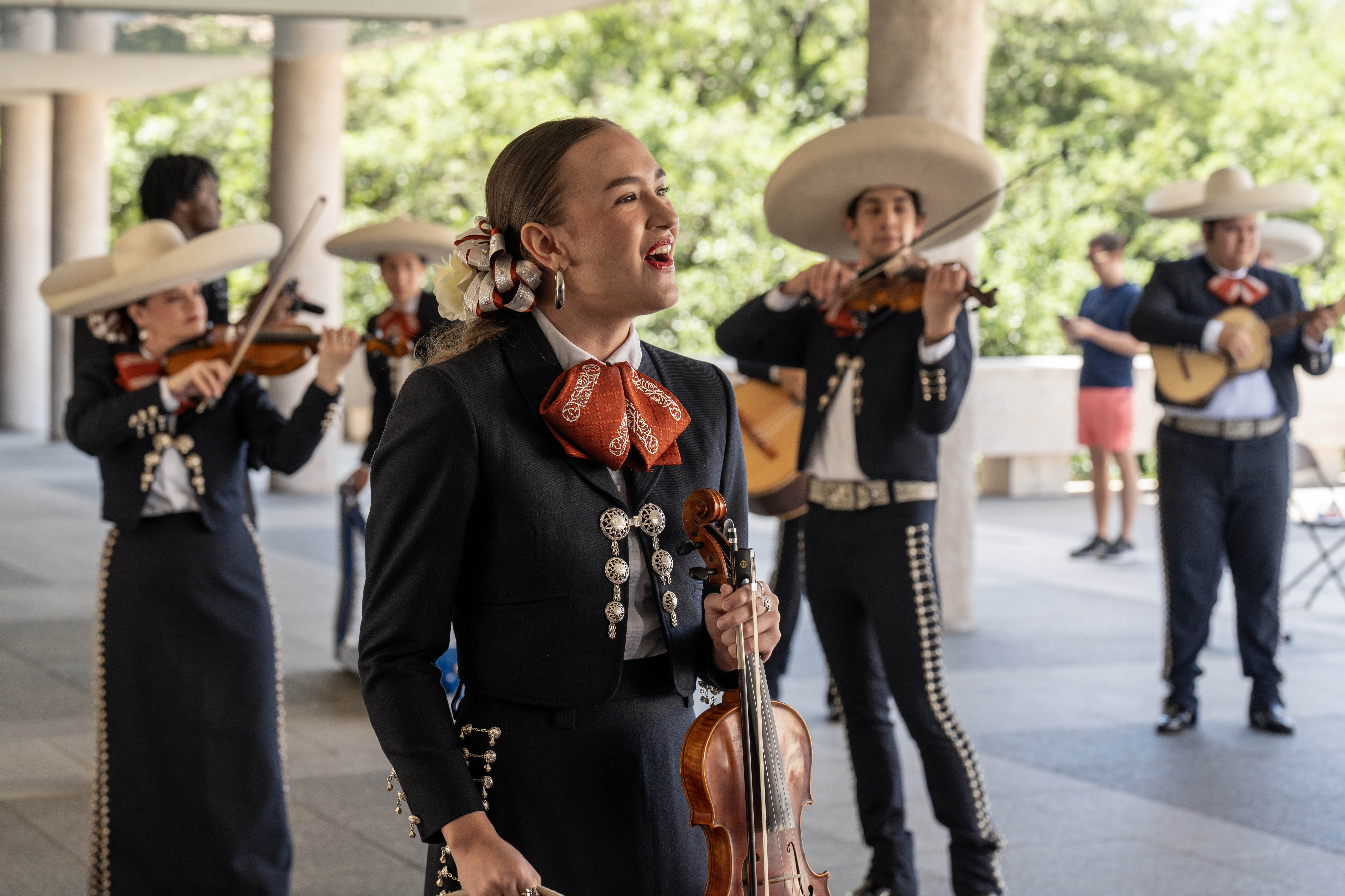 A mariachi singer performs on the LBJ Plaza