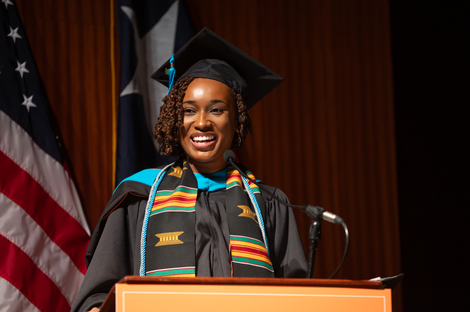 Morgan Brown smiles during her remarks at the 2024 LBJ School graduation ceremony