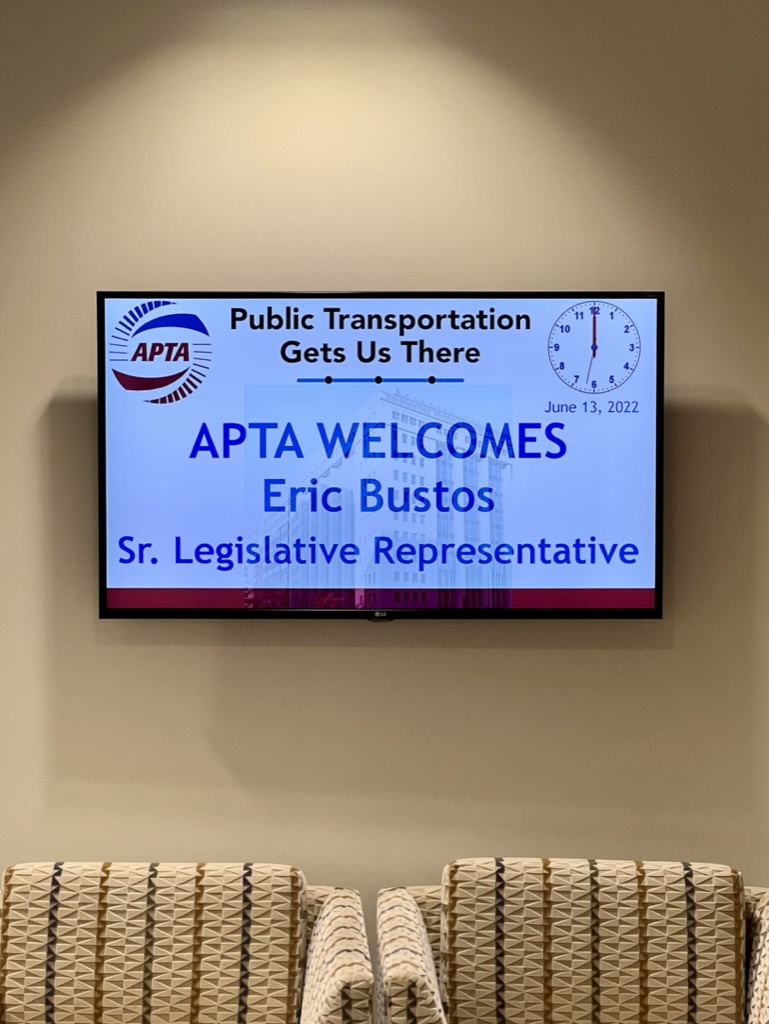 Photo of Screen that says "APTA Welcomes Eric Bustos, Sr Legislative Representative" 
