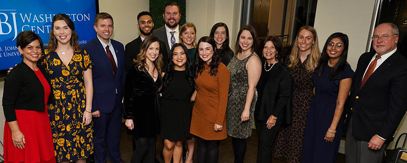 Robin Boone (far left) and Bill Shute (far left) with the 2019 cohort of LBJ DC Fellows at their graduation (Photo by Ralph Alswang)