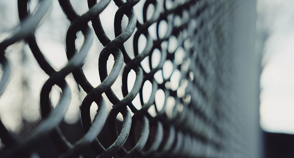 Chainlink fence. Credit: Thomas Knorr, Unsplash