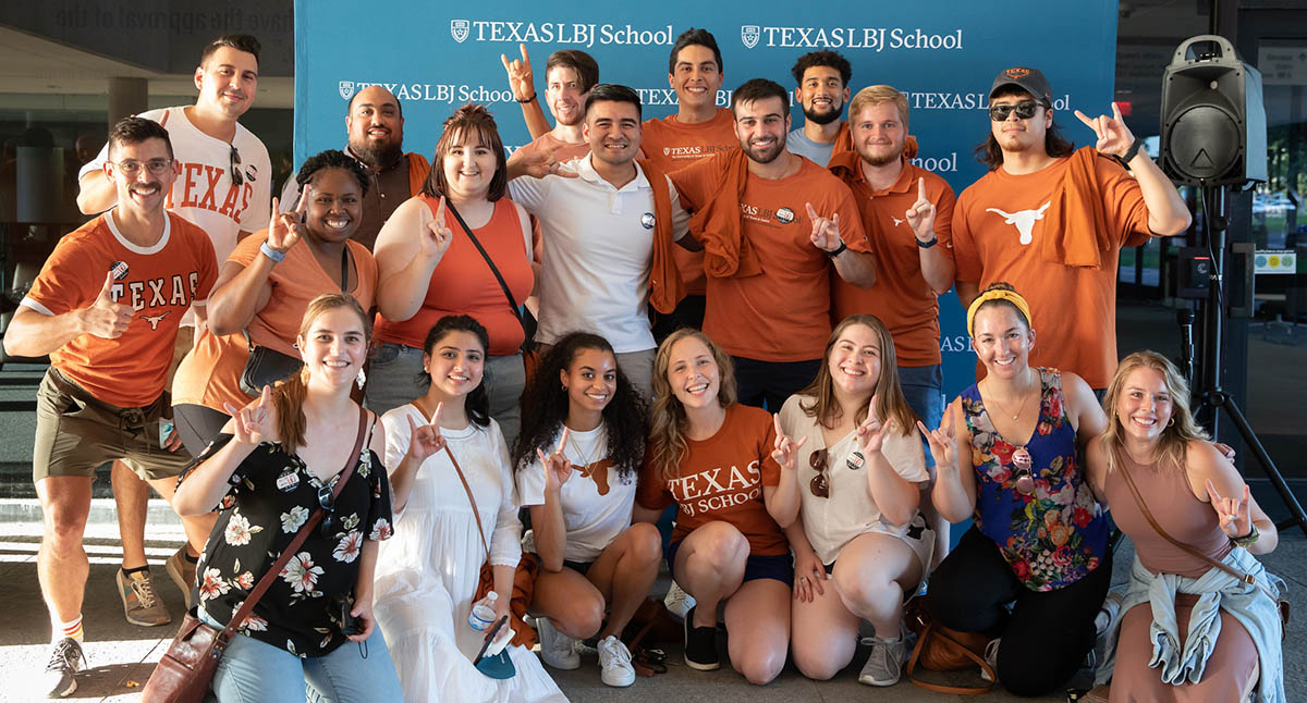Members of the incoming class flash the "Hook 'Em" sign at Gone to Texas 2021