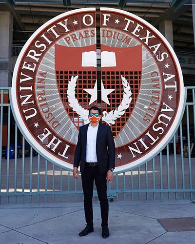 Gabriel Cortez (MGPS '21) in front of the UT shield at Darrell K Royal-Texas Memorial Stadium