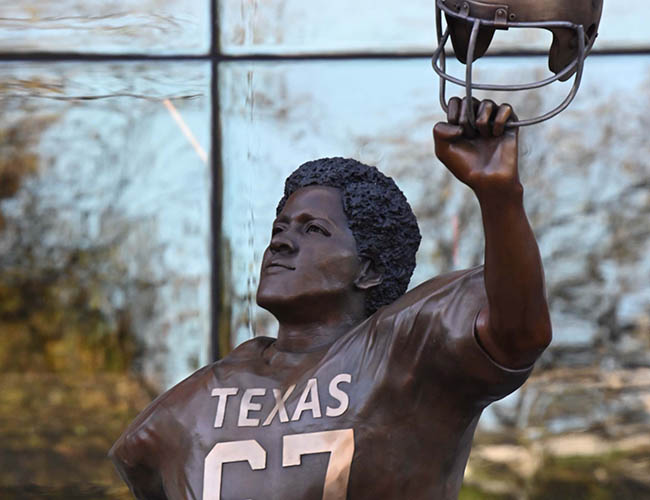 Statue honoring Julius Whittier (MPAff '76), Texas's first Black football letterman Credit: Marsha Miller