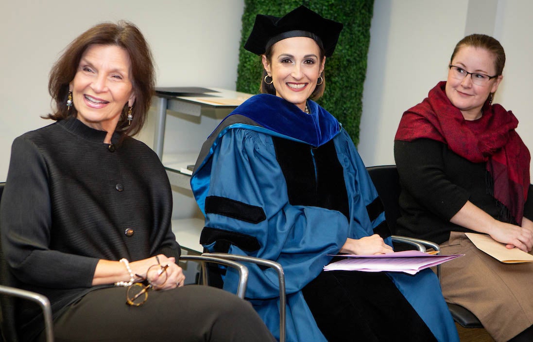 Dean Angela Evans with Professors Victoria deFrancesco Soto and Kate Weaver at the 2018 DC graduation