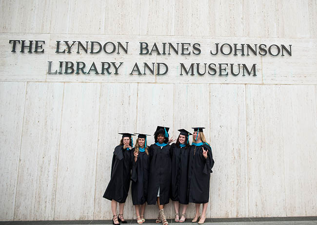A group of 2016 LBJ School grads in front of the LBJ Library facade. Credit: Callie Richmond