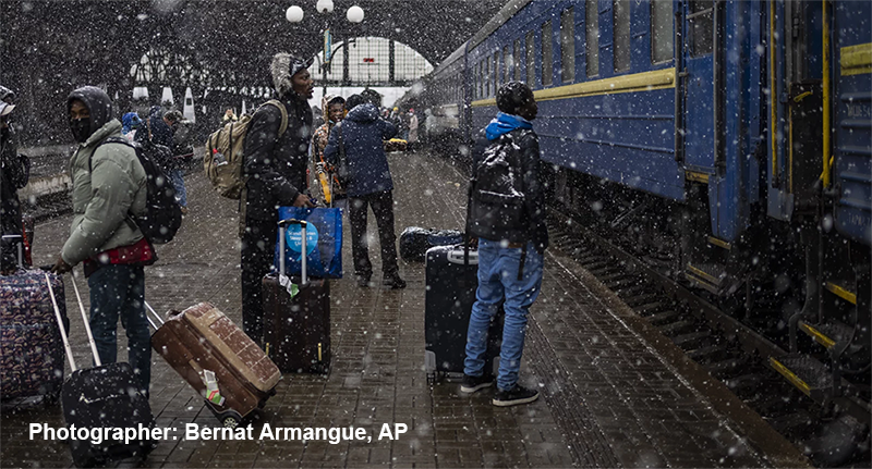 Nigerian students await a train in Lviv