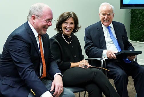 LBJ Washington Center Interim Director Bill Shute laughs with Dean Angela Evans and Lloyd Hand at the LBJ DC Fellows' graduation on Dec. 7