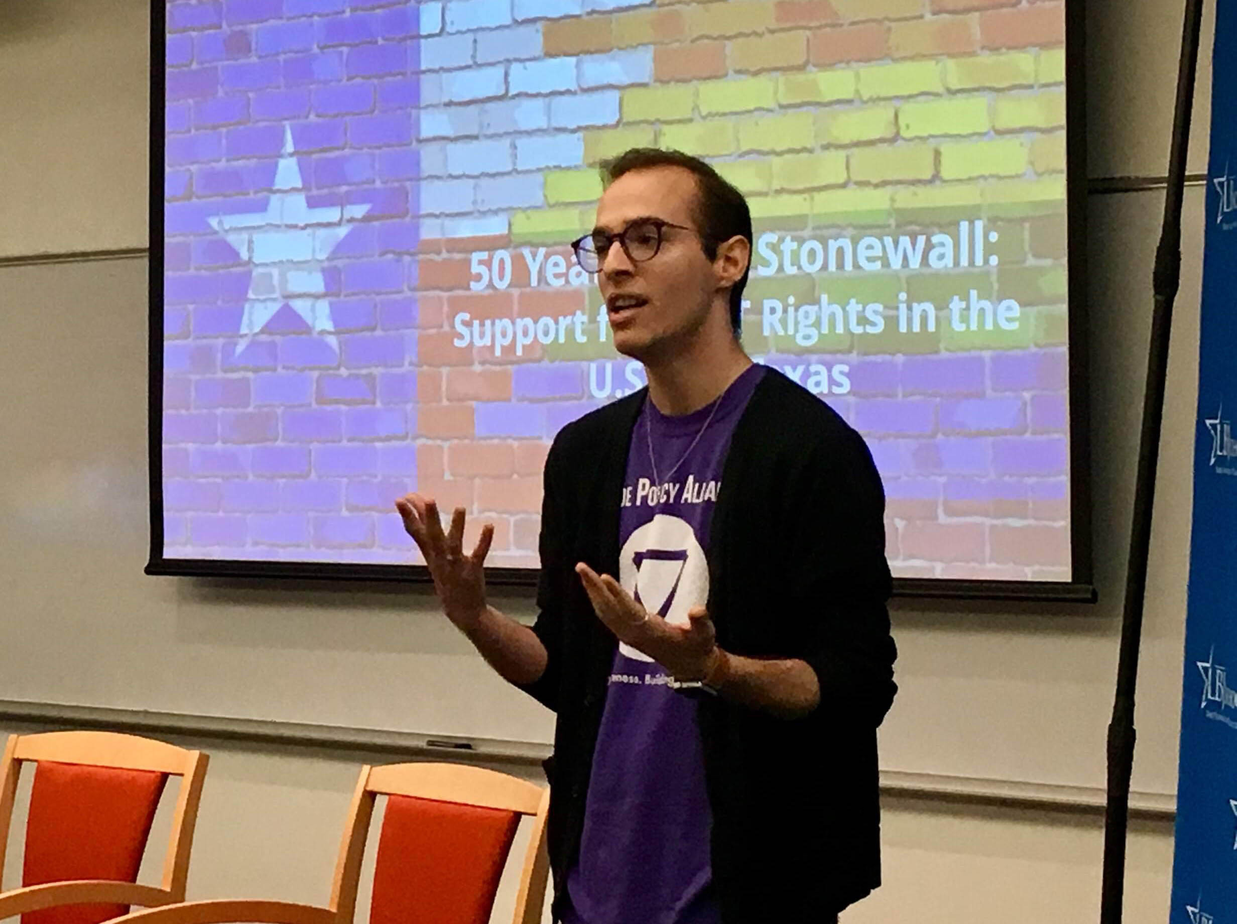 LBJ student Wayne Holstine (MPAff '19) speaks before the 50 Years After Stonewall event