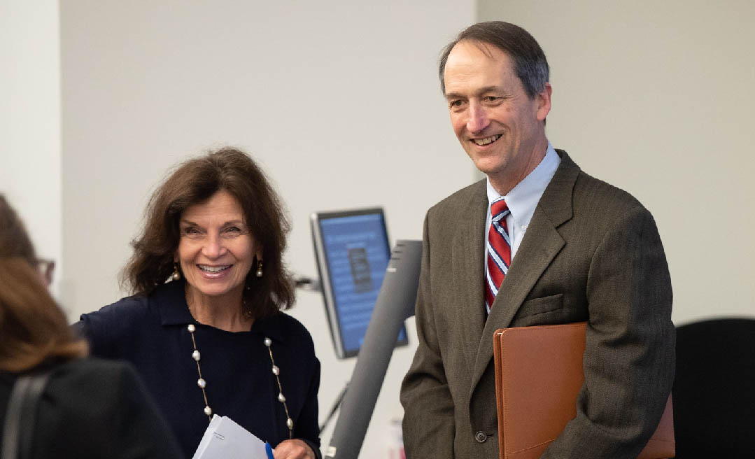 LBJ School Dean Angela Evans and Austin Smythe (MPAff '80)