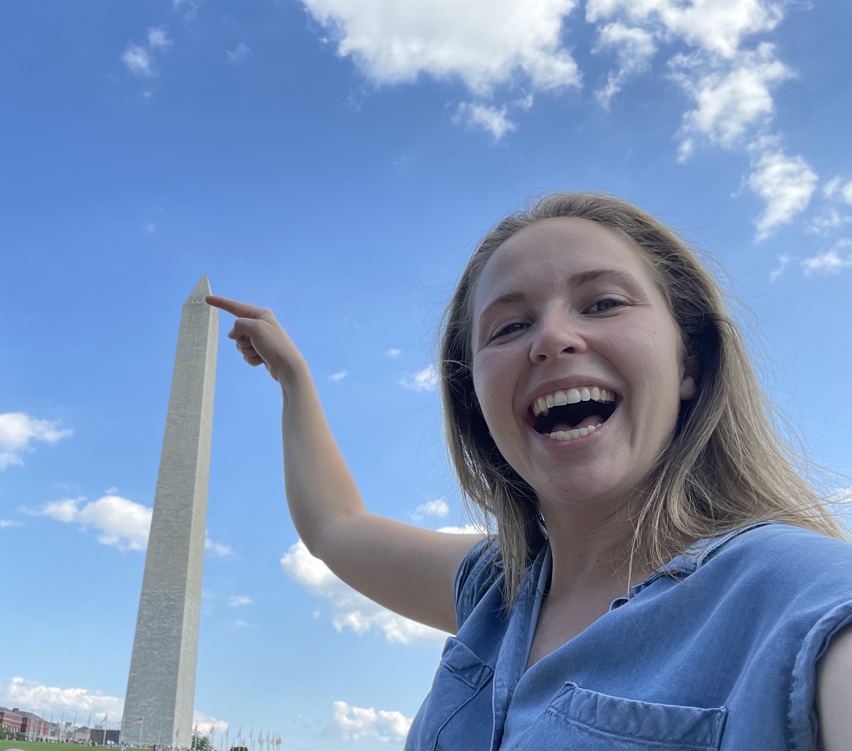 Smiling LBJ student pictured in front of the Washington Monument with blue sky background
