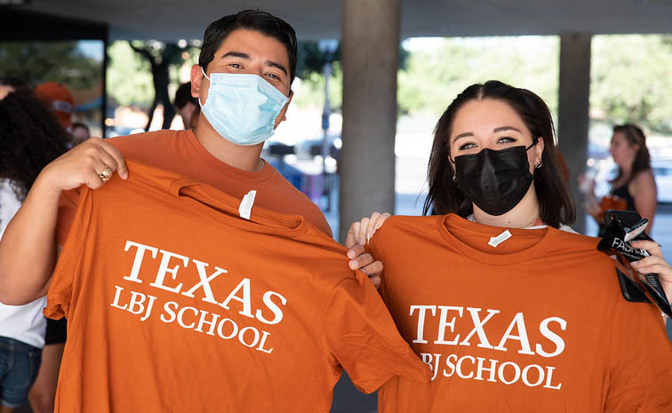 Incoming students show off their new LBJ School T-shirts at Gone to Texas 2021