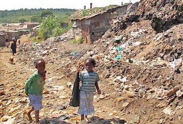 The Kibera slum in Nairobi, Kenya is home to between 200,000 and 1 million people, by many estimations the largest slum in Africa. The absence of government services, including rubbish removal, in Kibera and other informal settlements leads to everyday challenges for residents, including children. The Kibera slum in Nairobi, Kenya is home to between 200,000 and 1 million people, by many estimations the largest slum in Africa. The absence of government services, including rubbish removal, in Kibera and other informal settlements leads to everyday challenges for residents, including children.