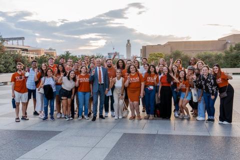 Students pose on Plaza with Tower in backdrop