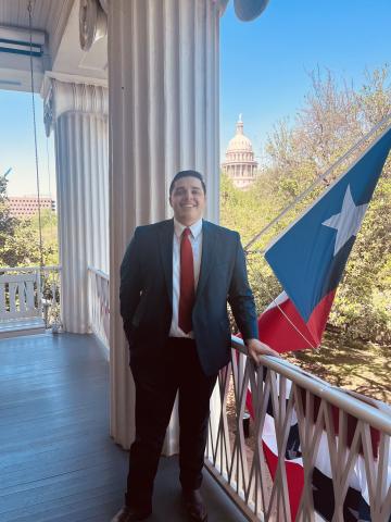 LBJ alumni, Steven Santoyo, in front of Capitol