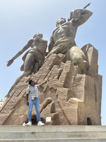 LBJ student, Devarier Smith, studying abroad in Senegal with monument