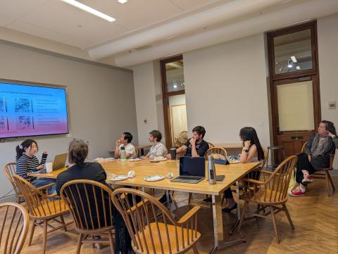students conversing around a table