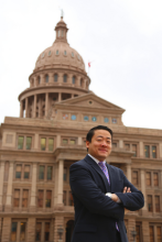 Gene Wu stands in front of TX Capitol