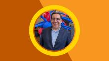 Cesar Martinez Espinosa headshot against burnt orange background