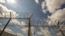 Razor wire fence with sunlight