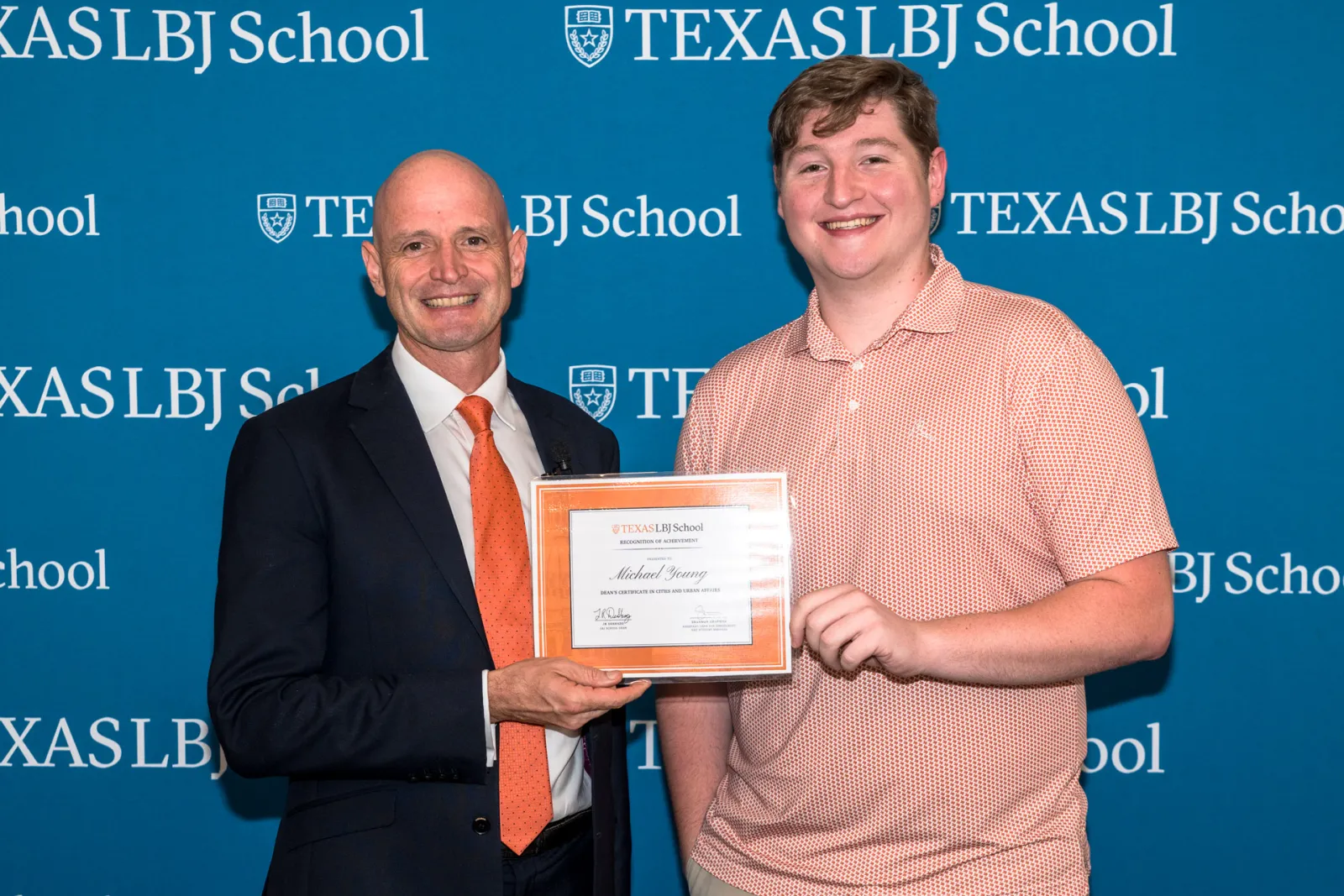 JR DeShazo posing with Michael Young, a Dean's Certificate recipient.