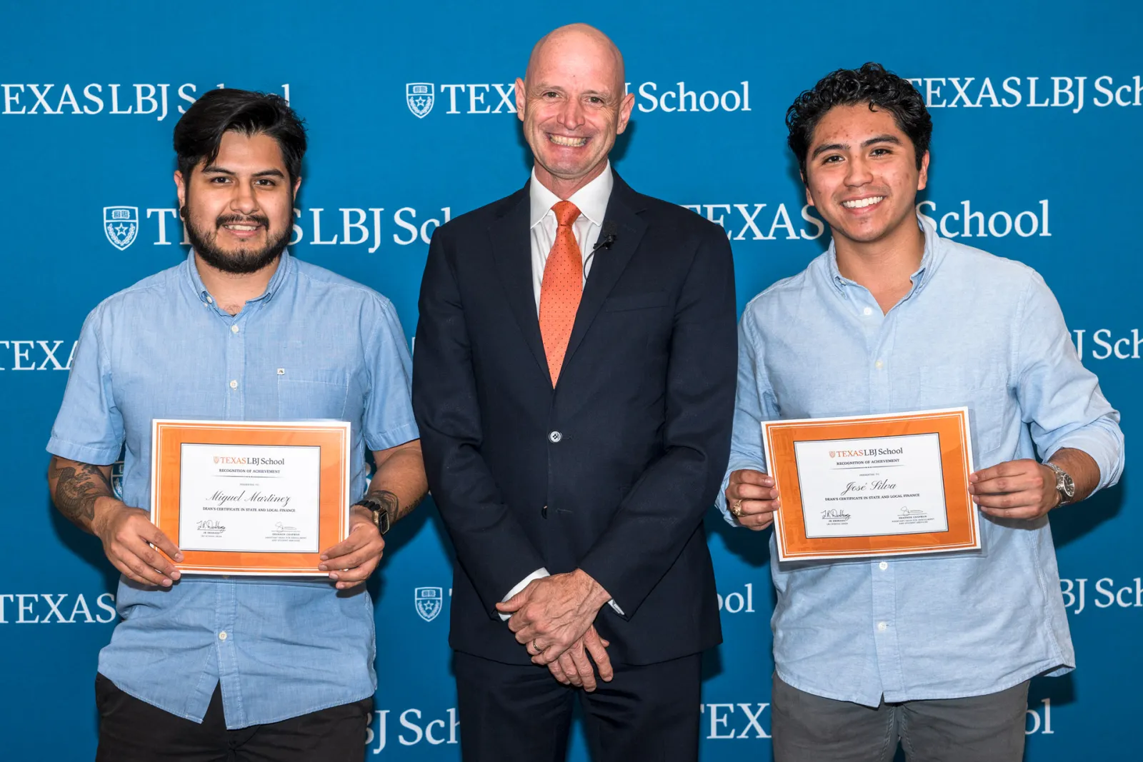 JR DeShazo posing with a pair of certificate winners during the award night ceremony