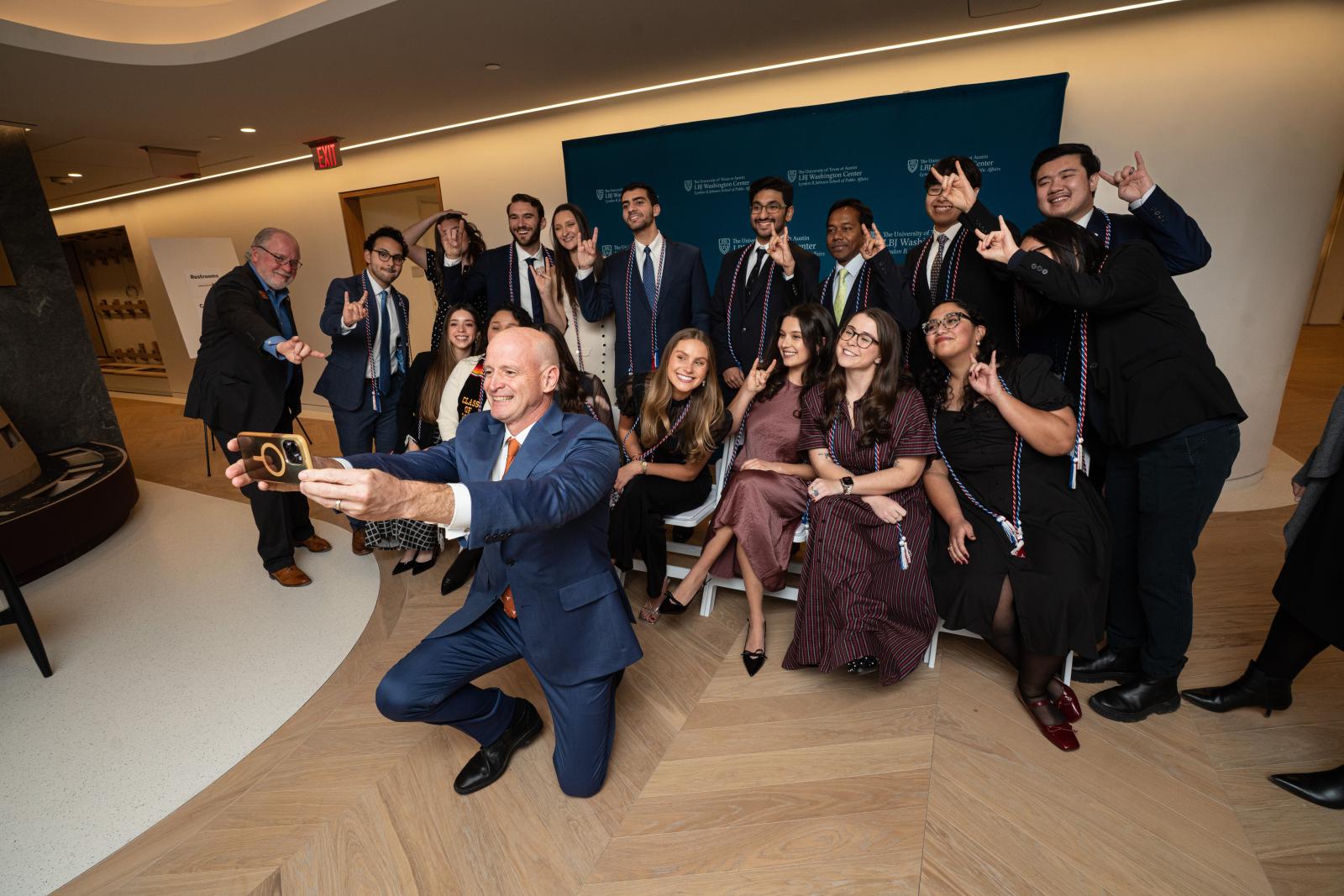 LBJ Graduate Sofia Odom at DC graduation with peers and Dean DeShazo