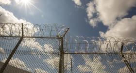 Razor wire fence with sunlight