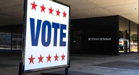 A vote sign outside of the LBJ School