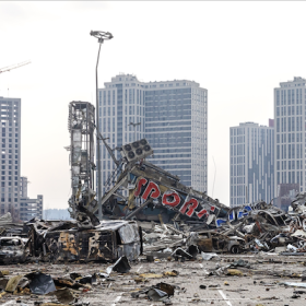 The image shows wreckage in a city from the war in Ukraine. 