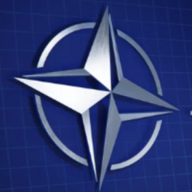 Blue background and silver compass rose. 
