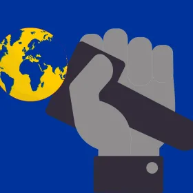 Image of hand holding world in blue and yellow colors