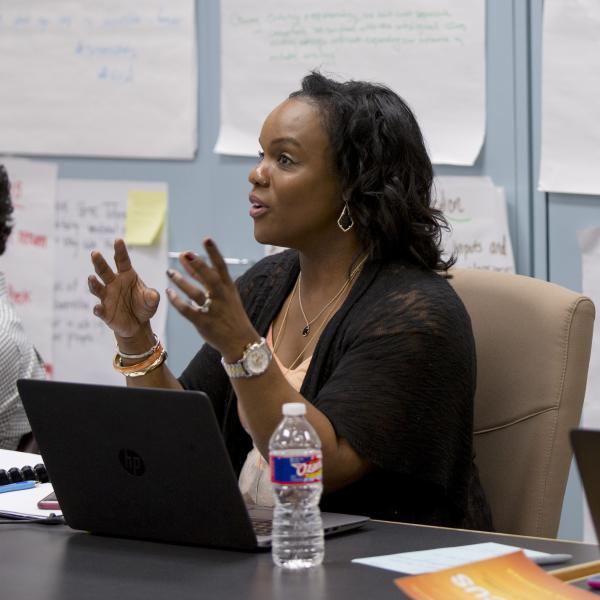 A woman sitting with her computer