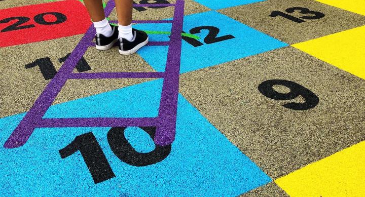 Kids playing hopscotch at PE