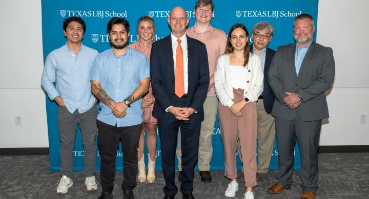 Dean JR DeShazo poses with various LBJ School awards winners