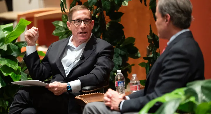 Professor Evan Smith interviews Joe Strauss during an LBJ School event.