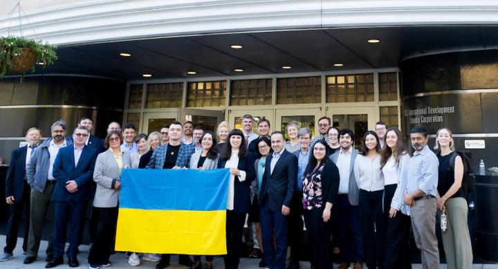 Event attendees holding Ukrainian flag