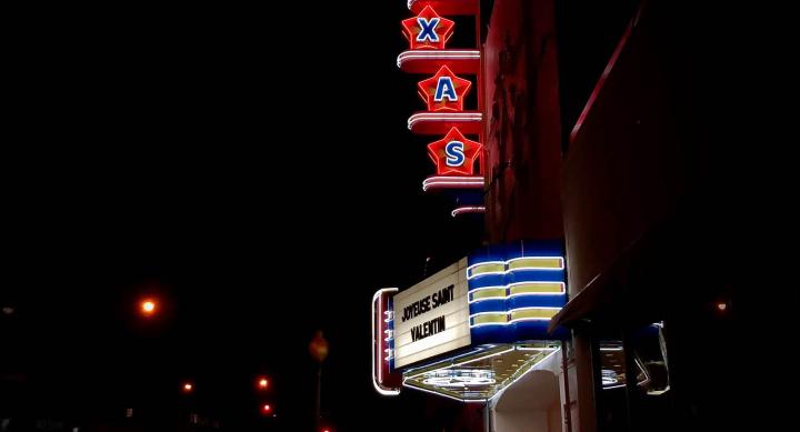 Neon theater marquee — credit Micah Boswell, Unsplash