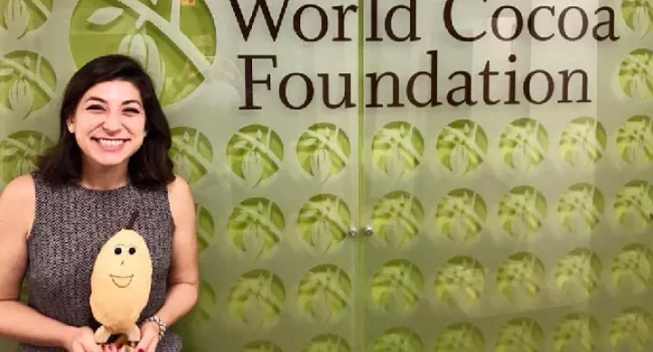 LBJ student Melanie Levine holds a stuffed cocoa bean at the World Cocoa Foundation